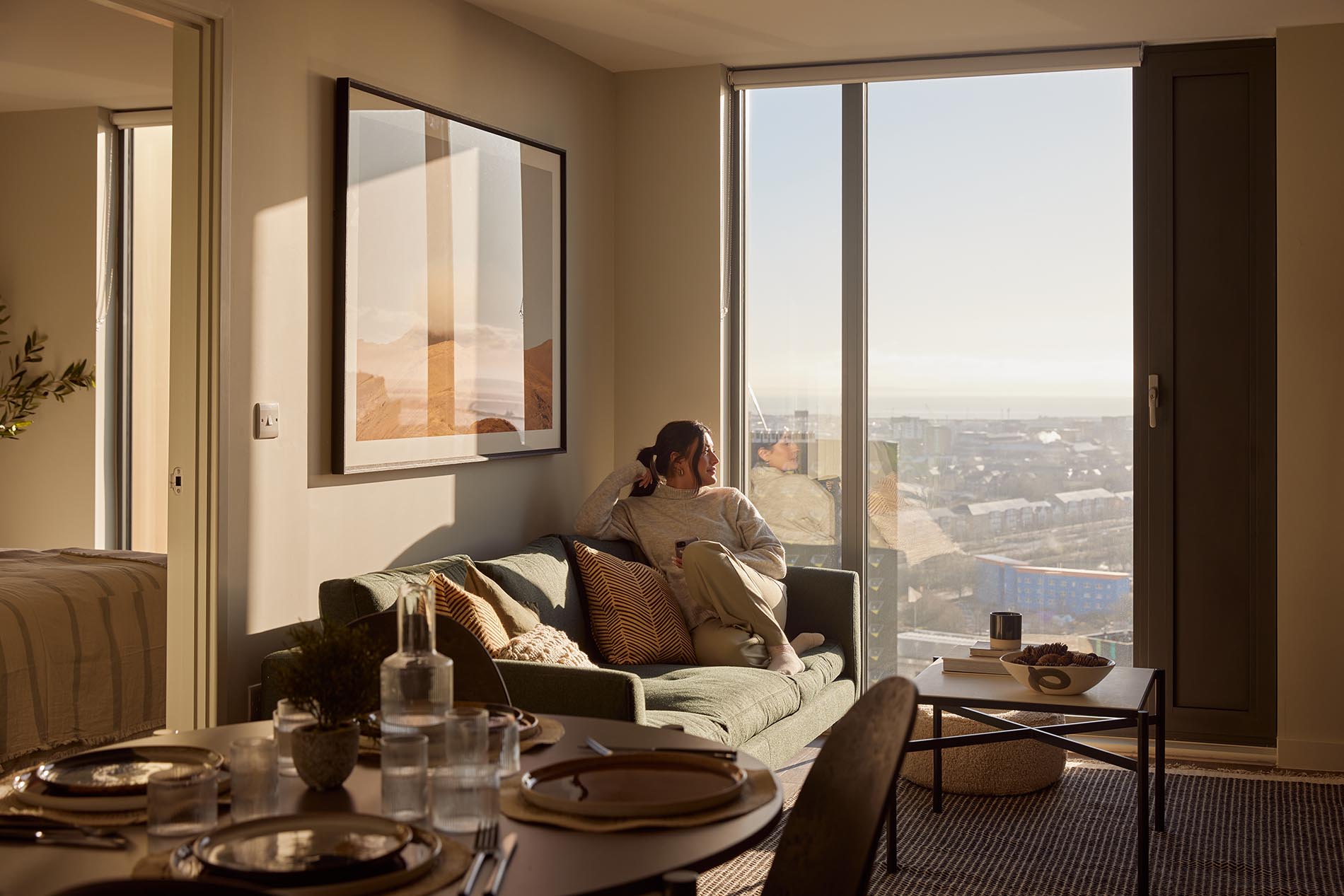 Sitting on Sofa by Window Sitting on Sofa by Window