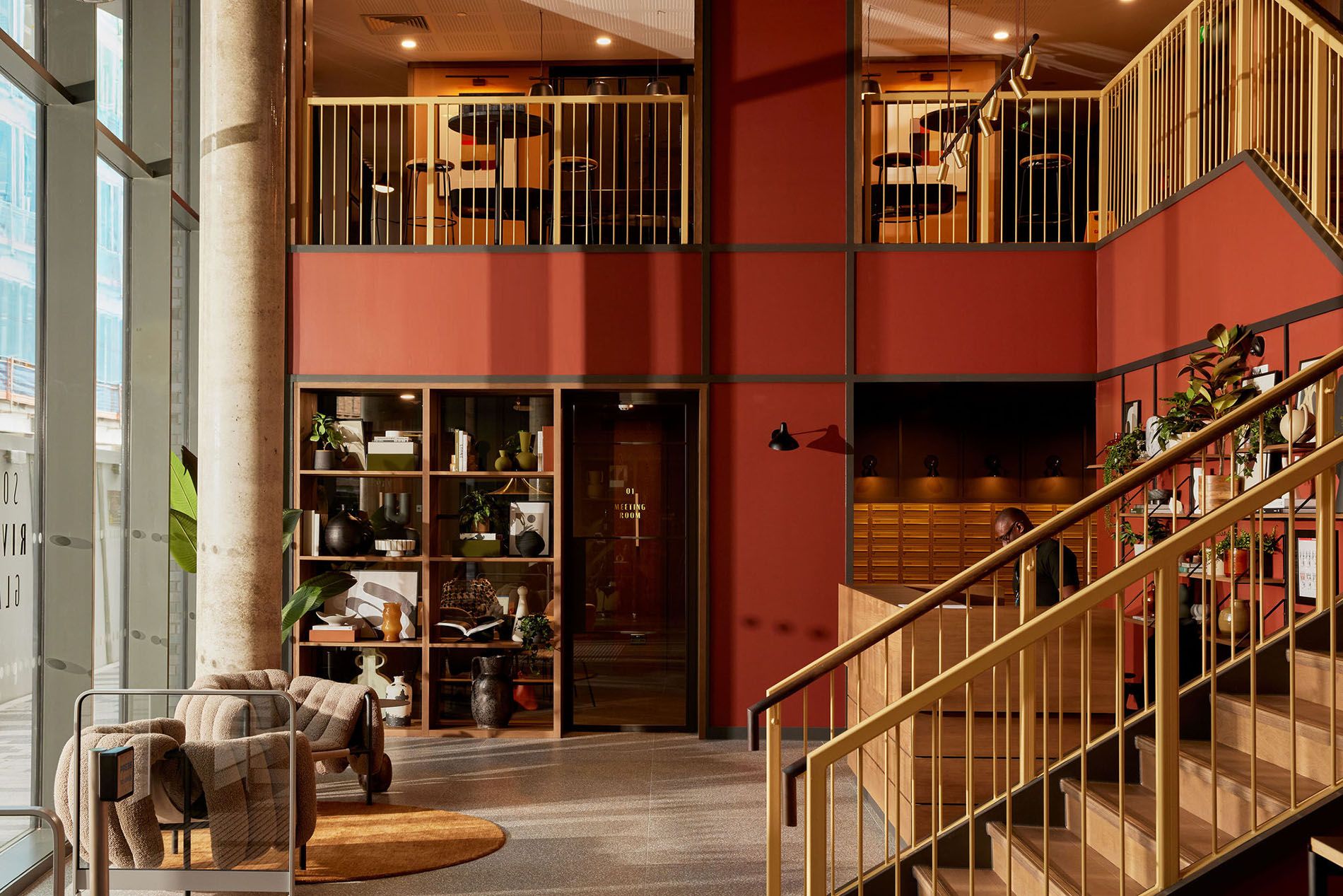 Lobby area with seating and stairs Lobby area with seating and stairs